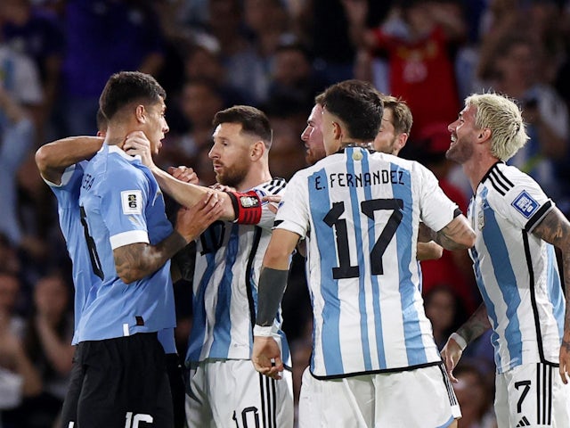Argentina's Lionel Messi clashes with Uruguay's Mathias Olivera on November 16, 2023