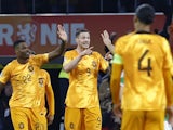 Netherlands' Wout Weghorst celebrates scoring their first goal with teammates on November 18, 2023