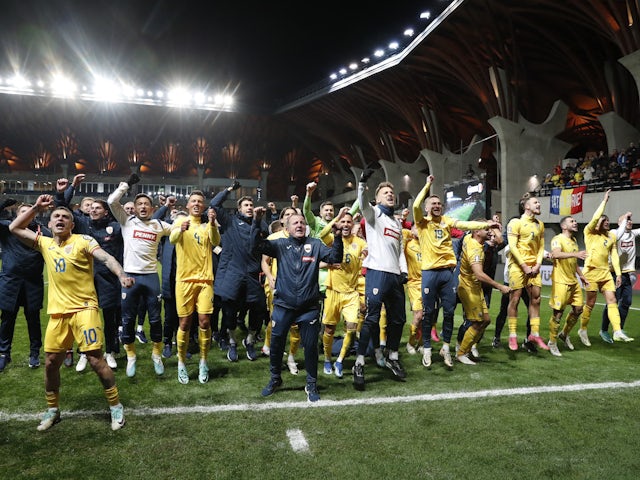 Romania players celebrate after qualifying for the Euro 2024 on November 18, 2023