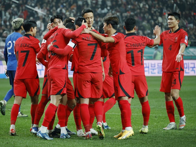South Korea's Hwang Ui-Jo celebrates scoring their fourth goal with teammates on November 16, 2023