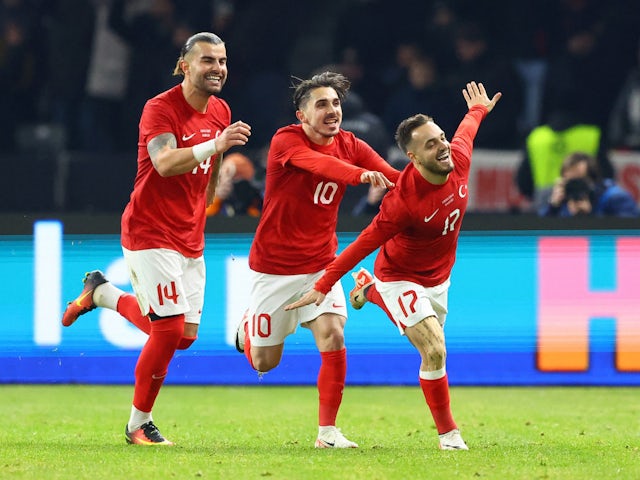 Turkey's Yusuf Sari celebrates scoring their third goal with Abdulkadir Omur and Abdulkerim Bardakci on November 18, 2023