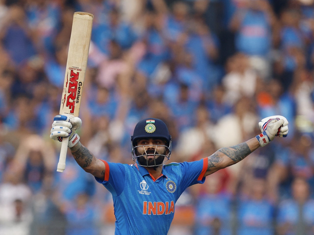 India's Virat Kohli celebrates after reaching his 50th century ...