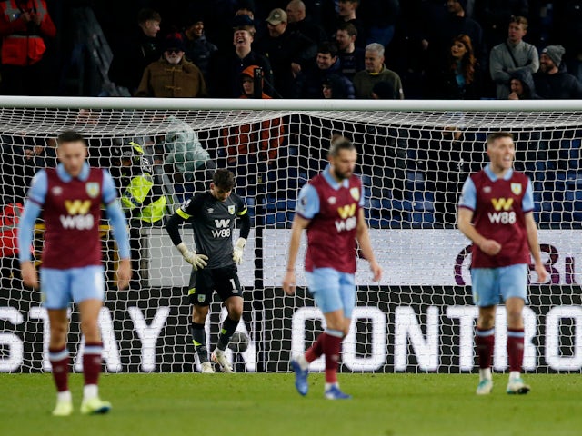 Burnley's James Trafford and teammates look dejected after conceding their second goal on November 25, 2023
