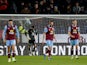 Burnley's James Trafford and teammates look dejected after conceding their second goal on November 25, 2023