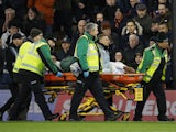 Crystal Palace's Cheick Doucoure is carried away in a stretcher after sustaining an injury on November 25, 2023