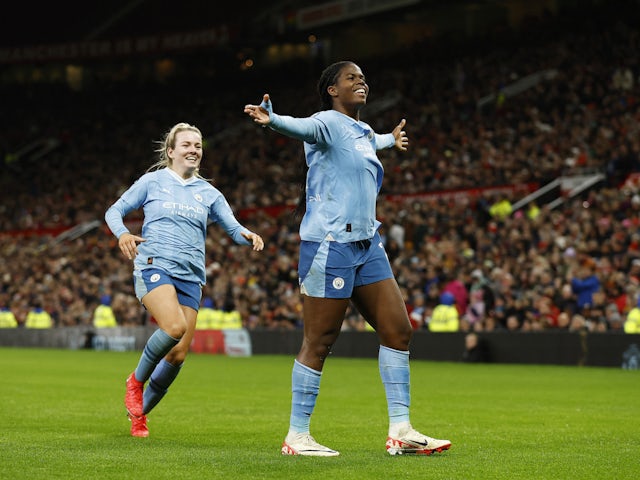 Manchester City Women's Khadija Shaw celebrates scoring their third goal with Lauren Hemp on November 19, 2023