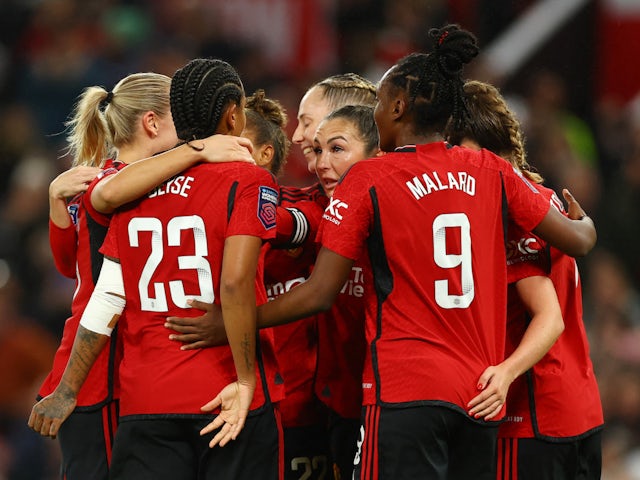 Manchester United Women's Katie Zelem celebrates scoring their first goal with teammates on November 19, 2023