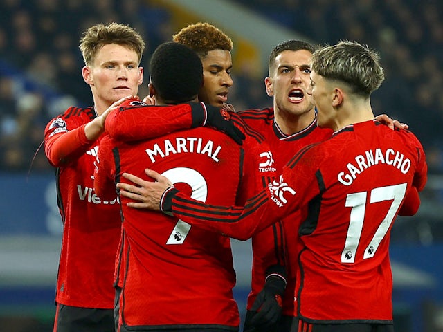 Manchester United's Marcus Rashford celebrates scoring their second goal with teammates on November 26, 2023