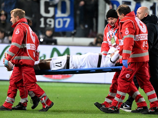 Napoli's Mathias Olivera is stretchered off after sustaining an injury on November 25, 2023