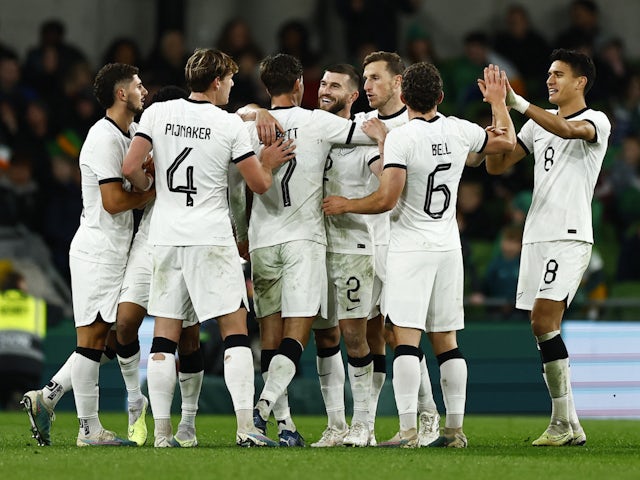 New Zealand's Matthew Garbett celebrates scoring their first goal with teammates on November 21, 2023