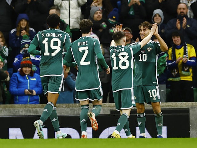 Northern Ireland's Dion Charles celebrates scoring their second goal with Paul Smyth, Trai Hume and Shea Charles on November 20, 2023
