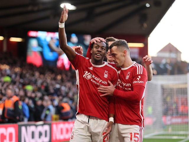 Nottingham Forest's Anthony Elanga celebrates scoring their first goal with Chris Wood and Harry Toffolo on November 25, 2023