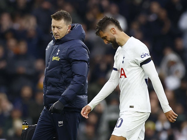 Tottenham Hotspur's Rodrigo Bentancur walks off the pitch to be substituted after sustaining an injury on November 26, 2023