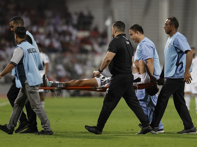 United Arab Emirates' (UAE) Sultan Adil is stretchered off after sustaining an injury on November 21, 2023