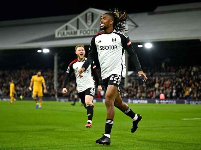 Fulham's Alex Iwobi celebrates scoring their first goal on November 27, 2023