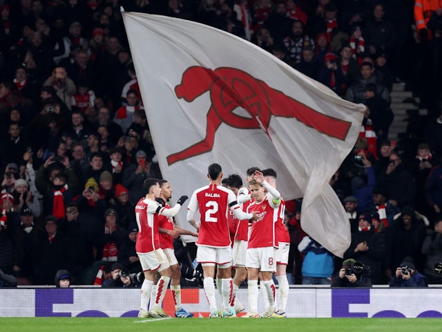 Arsenal's Martin Odegaard celebrates scoring their fifth goal with teammates on November 29, 2023