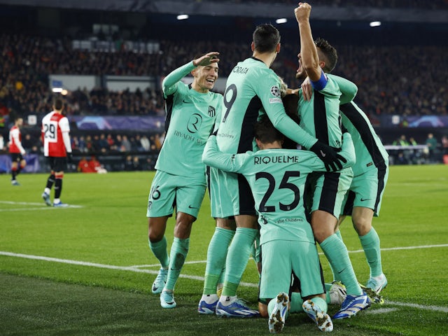 Atletico Madrid's Mario Hermoso celebrates scoring their second goal with teammates on November 28, 2023