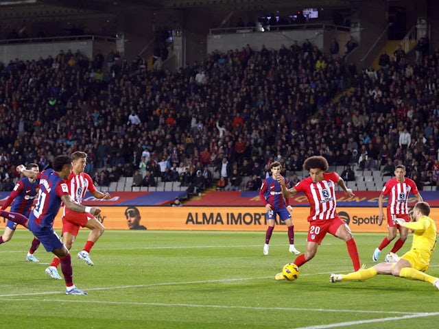 Barcelona's Raphinha shoots at goal against Atletico Madrid on December 3, 2023