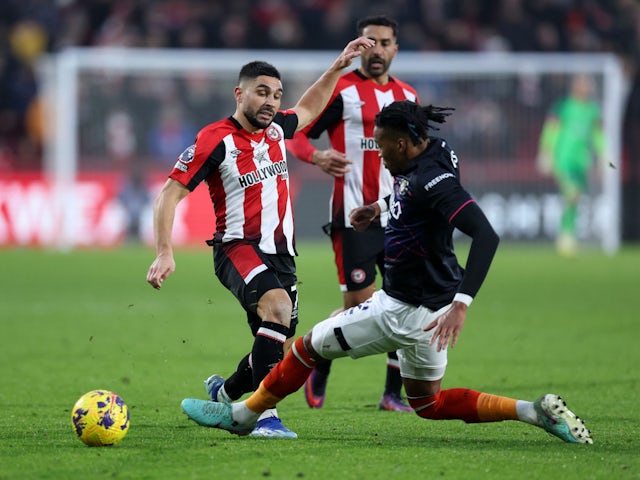 Brentford's Neal Maupay in action with Luton Town's Gabriel Osho on December 2, 2023