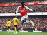 Arsenal's Bukayo Saka celebrates scoring against Wolverhampton Wanderers on December 2, 2023
