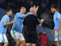 Manchester City's Erling Haaland, Mateo Kovacic and Ruben Dias remonstrate with referee Simon Hooper on December 3, 2023