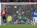 Manchester United's Marcus Rashford scores a penalty against Everton on November 26, 2023