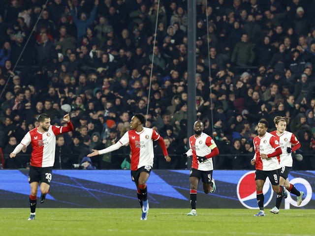 Feyenoord's Mats Wieffer (not pictured) celebrates scoring their first goal with teammates on November 28, 2023