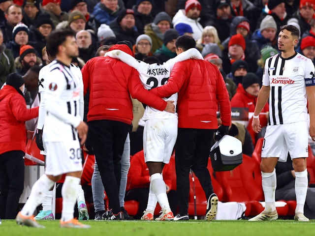 LASK Linz's Ibrahim Mustapha is helped off the pitch after sustaining an injury on November 30, 2023