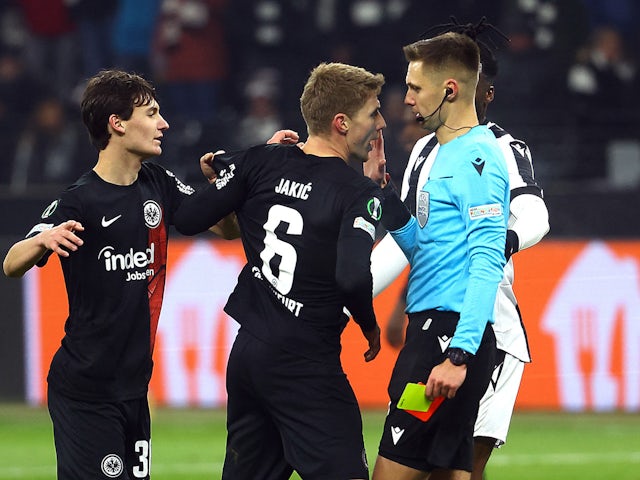 Eintracht Frankfurt's Kristijan Jakic reacts after being shown a red card by referee Damian Sylwestrzak on November 30, 2023
