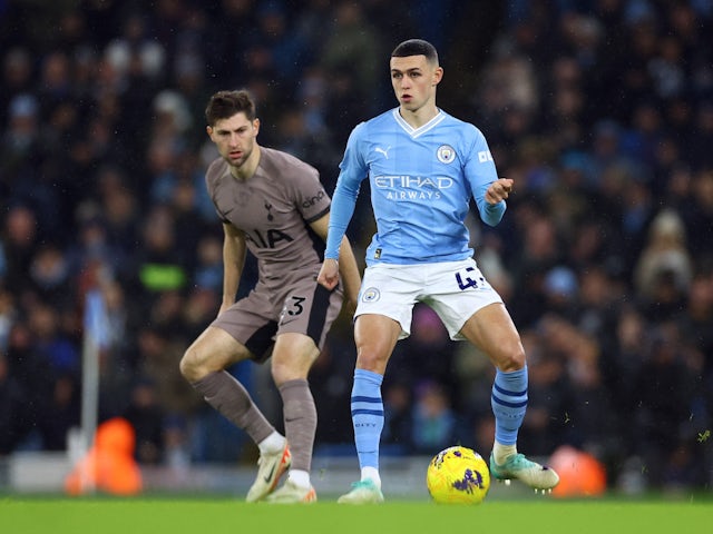  Tottenham Hotspur's Ben Davies in action with Manchester City's Phil Foden on December 3, 2023
