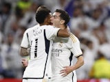 Real Madrid's Rodrygo celebrates scoring their first goal with Brahim Diaz on November 29, 2023