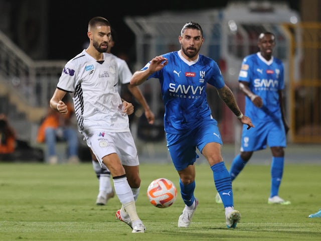 Al-Hilal's Ruben Neves in action with Al Shabab's Yannick Carrasco on September 29, 2023