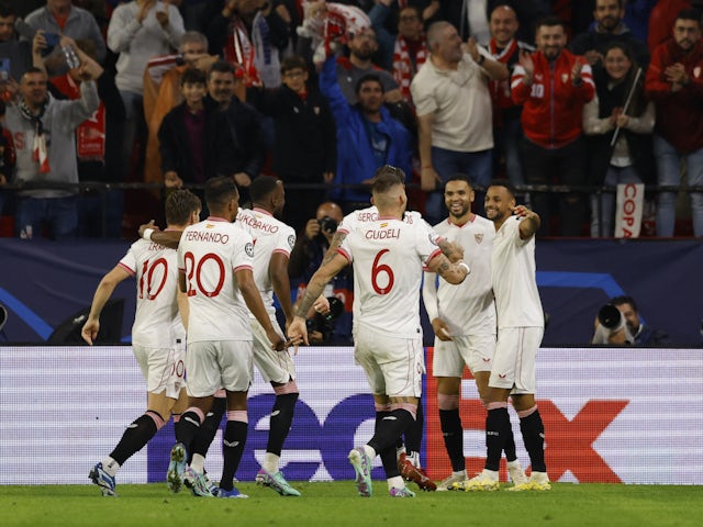 Sevilla's Youssef En-Nesyri celebrates scoring their second goal with teammates on November 29, 2023