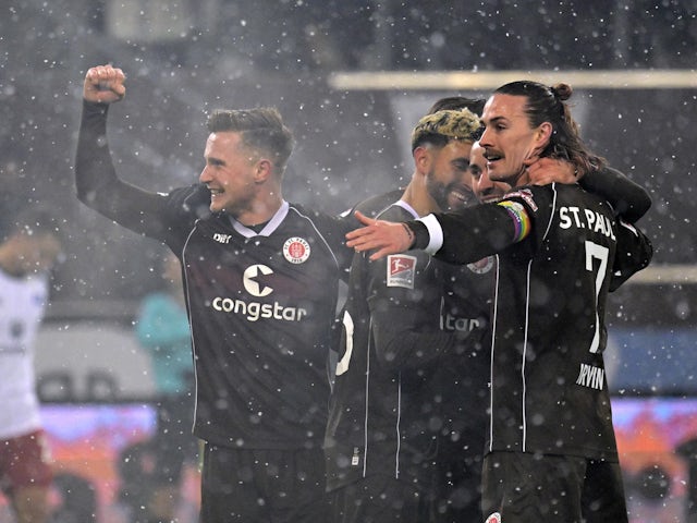 St Pauli's Jackson Irvine celebrates with teammates on December 1, 2023