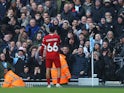 Liverpool's Trent Alexander-Arnold celebrates scoring in front of Manchester City supporters on November 25, 2023