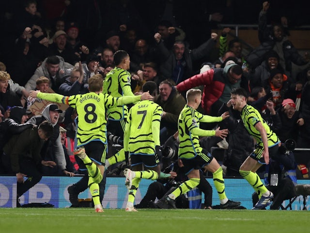 Arsenal's Declan Rice celebrates scoring their fourth goal with teammates on December 5, 2023