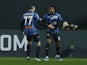 Atalanta's Ademola Lookman celebrates scoring their first goal with Davide Zappacosta on December 9, 2023