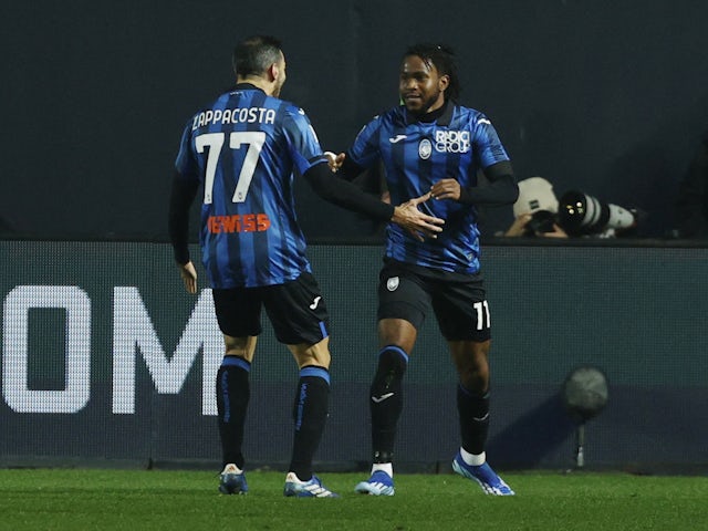 Atalanta's Ademola Lookman celebrates scoring their first goal with Davide Zappacosta on December 9, 2023