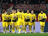 Borussia Dortmund's Julian Ryerson celebrates scoring their first goal with teammates on December 3, 2023