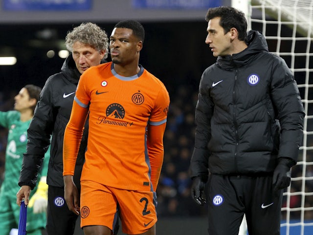 Inter Milan's Denzel Dumfries is substituted after sustaining an injury on December 3, 2023