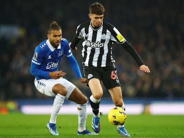 Newcastle United's Lewis Miley in action with Everton's Dominic Calvert-Lewin on December 7, 2023