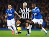 Newcastle United's Bruno Guimaraes in action with Everton's Abdoulaye Doucoure on December 7, 2023
