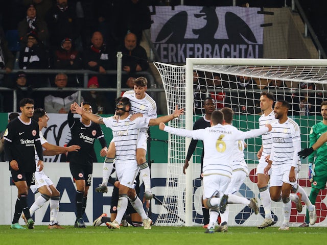 FC Saarbrucken's Kai Brunker celebrates scoring a goal with teammates on December 6, 2023