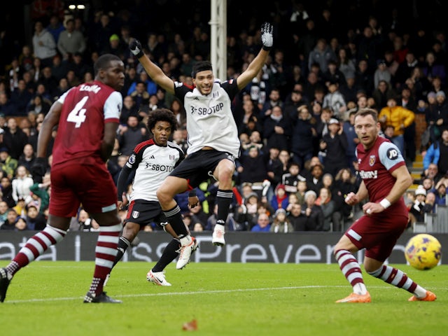 Fulham's Raul Jimenez celebrates as Willian scores against West Ham United on December 10, 2023