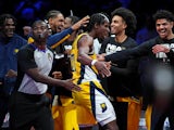 Indiana Pacers forward Aaron Nesmith celebrates with his teammates during the fourth quarter against the Milwaukee Bucks on December 7, 2023