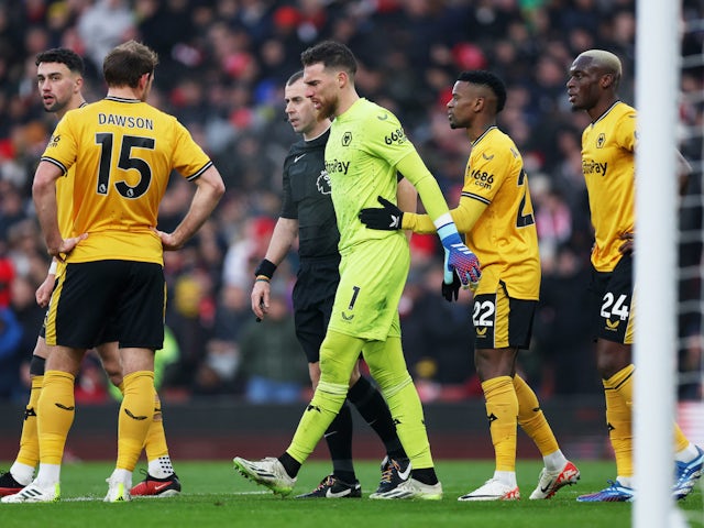 Wolverhampton Wanderers' Jose Sa walks off the pitch after sustaining an injury on December 2, 2023