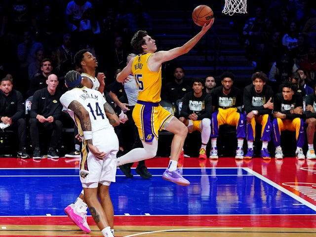 Los Angeles Lakers guard Austin Reaves shoots the ball against New Orleans Pelicans forward Brandon Ingram on December 7, 2023