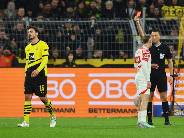 Borussia Dortmund's Mats Hummels is shown a red card by referee Sven Jablonski on December 9, 2023