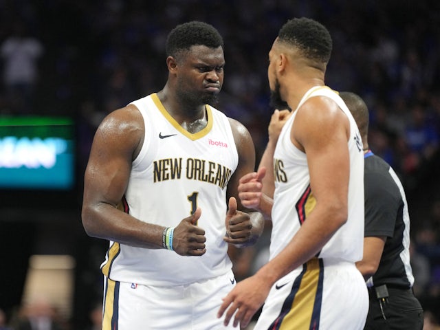 New Orleans Pelicans forward Zion Williamson (1) gestures while talking with guard CJ McCollum (right) on December 5, 2023