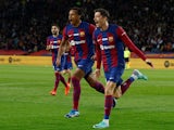 FC Barcelona's Robert Lewandowski celebrates scoring their first goal with Jules Kounde on December 10, 2023